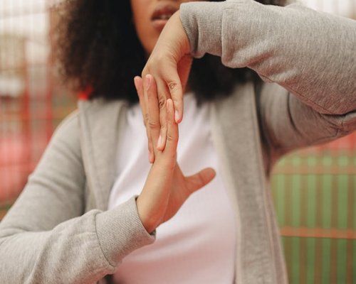 Person stretching hands in the office